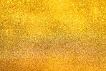 Gold background light. Golden glitter texture.