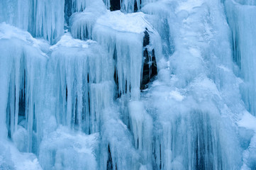 Icicles Hanging Down From a Hillside. Freezing temperatures make for an icy landscape along a mountain road in British Columbia, Canada.