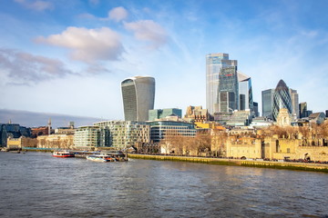 Obraz premium Buildings of the London United Kingdom skyline along the river Thames on a winter day