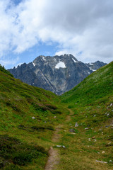 Fototapeta premium Faint Trail Climbs Through Valley