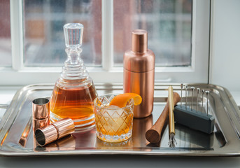 Cocktail with bar tools 