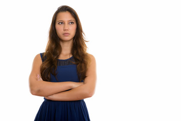 Portrait of young beautiful woman thinking with arms crossed