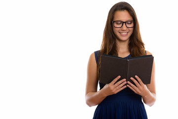 Portrait of happy young nerd woman reading book