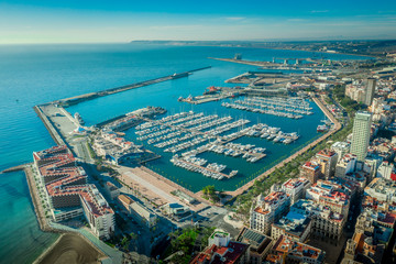 The marina port of Alicante with luxury sailboats on a sunny morning