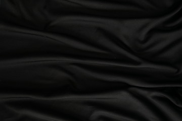 luxury black silk background. texture of black bedding
