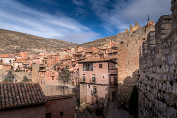 Fototapeta na wymiar Aerial panorama view of Albarracin in Teruel Spain, with red sandstone terracotta medieval houses, Moorish castle and ancient city walls voted most beautiful Spanish village