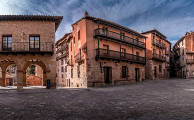 Aerial panorama view of Albarracin in Teruel Spain, with red sandstone terracotta medieval houses, Moorish castle and ancient city walls  voted most beautiful Spanish village