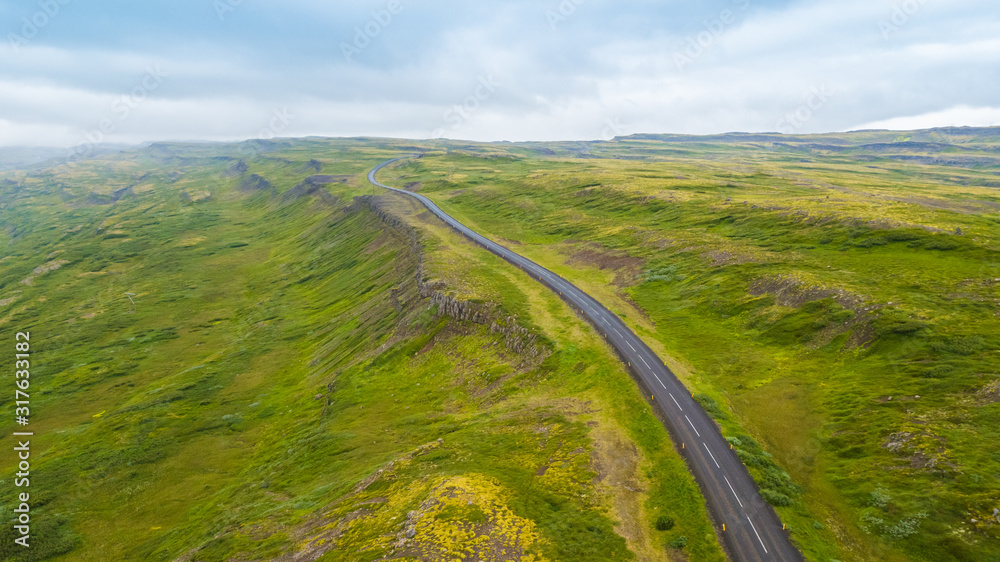 Wall mural summertime aerial view of landscape on the road in iceland, west fjords in iceland