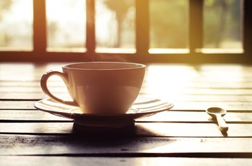 cup of coffee on wooden table