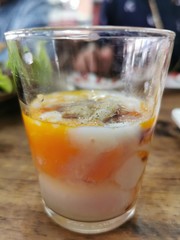 Soft-boiled egg, add soy sauce and pepper in a glass