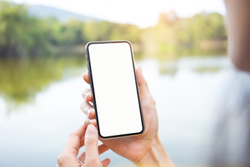 Mockup image blank white screen cell phone.man hand holding texting using mobile.background empty space for advertise text.people contact marketing business,technology 