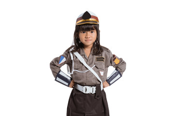 Asian little girl wearing a police uniform with two hands on her waist on an isolated background