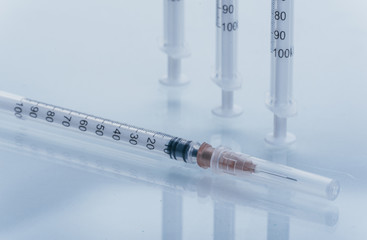 Medicine, Injection, vaccine and disposable syringe isolated, drug concept. Sterile vial medical. Medical Syringe needle. Macro close up on backgrounds gray.
