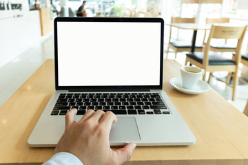 mockup image blank screen computer with white background for advertising text,hand man using laptop contact business search information on desk at coffee shop.marketing and creative design