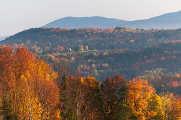 Morning sunrise during fall foliage season, Stowe, Vermont, USA