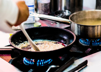 Chef cooking, Chef preparing food in the kitchen, Chef decorating dish, closeup.