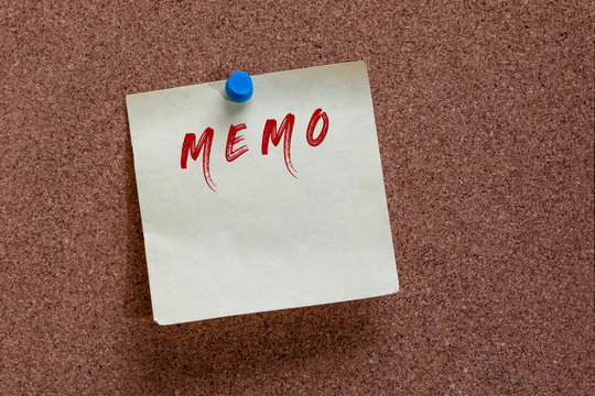 Attention grabbing sticky with the word Memo written on the top of sticky note pinned to board