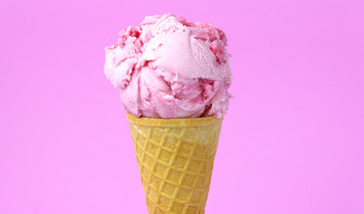 Ice cream flavoured Strawberry in waffle cone isolated on pink background, Closeup Front view Food...