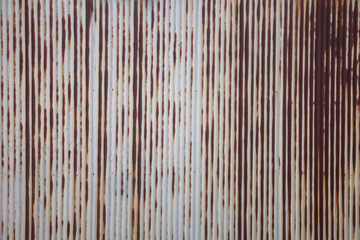 Rush metal background, Vintage rust door older slide gate, old rooftop wall with the rush water from steel, Corrugated shutter gate while raining with water rushing towards the gutter, closeup texture