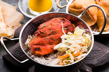 Close-up of a plate of chopped tandoori chicken
