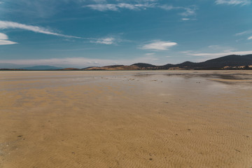 Fototapeta na wymiar view of Dunalley Beach in Tasmania, Australia with sandbanks and shallow pristine water