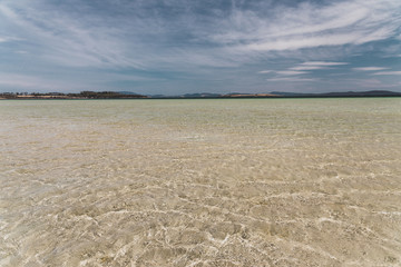 view of Dunalley Beach in Tasmania, Australia with sandbanks and shallow pristine water