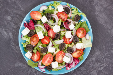 Fresh greek salad with feta cheese and vegetables. Best food for slimming containing vitamins