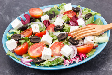 Greek salad with feta cheese and vegetables. Healthy meal as source vitamins