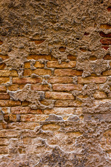 Old weathered brick texture on a building wall