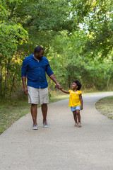 Obraz premium Portrait of an African American father taking a walk.