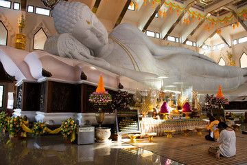 Large reclining Buddha marble statue for people and travelers travel visit and respect praying at...