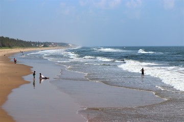young men having fun on the beach