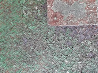 The steel surface is rusty green 