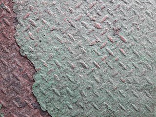 The steel surface is rusty green 