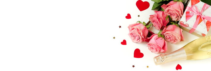Obraz na płótnie Canvas Valentine's day background banner. Bouquet of pink roses flowers, gift box and champagne bottle isolated on white background with copy space. Top view flat lay