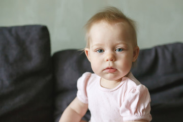 Sweet serious little infant girl portrait close-up