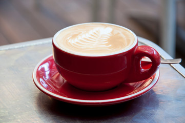 coffee with red cup and saucer
