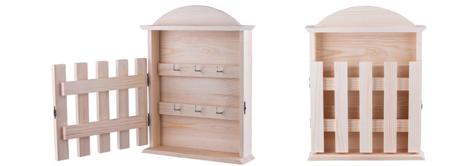 Wooden key holder with open and closed door.
