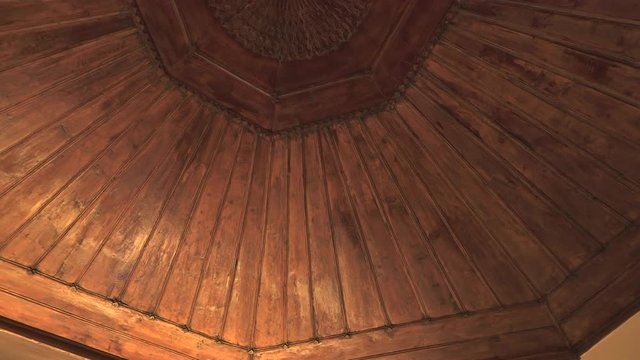 Wooden ornamented ceiling architecture. In architecture and decorative art, ornament is a decoration used to embellish parts of a building or object. Large figurative elements such as monumental sculp