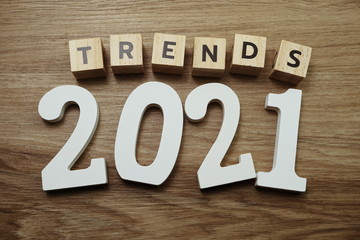 Trends 2021 word alphabet letters on wooden background