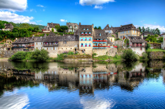 Part of Argentat, France, Reflecting in the Calm Water