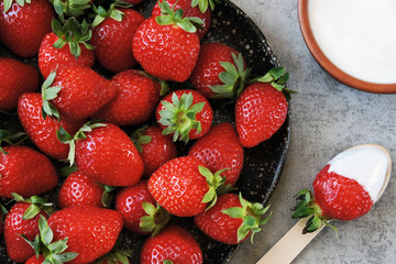 Fresh strawberries with cream. Juicy red strawberries.