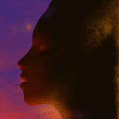 Profile of an African girl on a sunset background. 