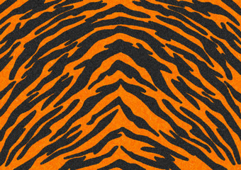 The Black-Orange Tiger Stripes Fur texture, carpet animal skin background, black and orange theme color, look smooth, fluffy and soft, fashion clothes textile concept. Design by using photoshop brush.