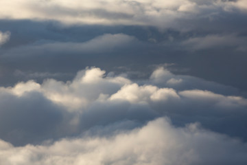 Aerial view of clouds seen from the plane window