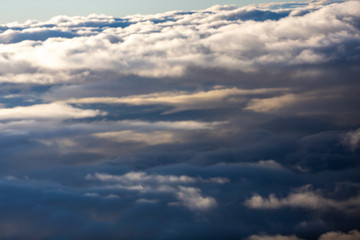 Aerial view of clouds seen from the plane window