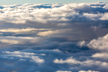 Aerial view of clouds seen from the plane window