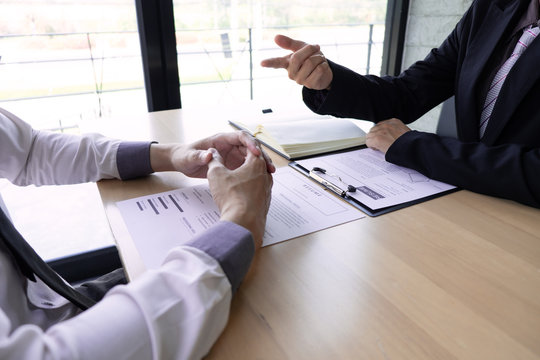Job seeker listening interview employee talk about job description for job interview in the office