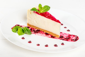 Slice of cheesecake garnished with mint garnished