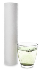 Glass of dirty water and filter on white background